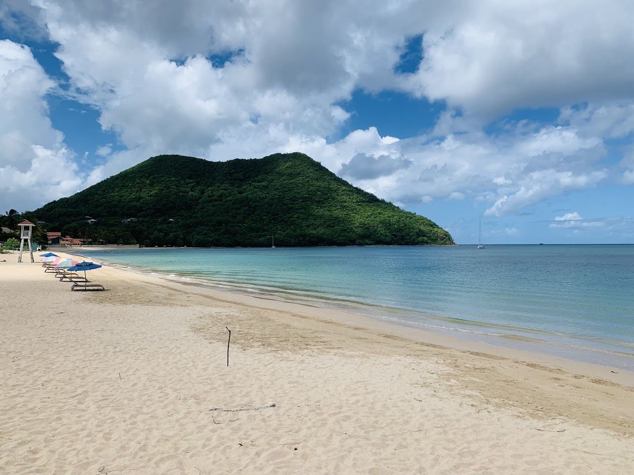 Calm golden sand and gentle water at a sheltered family beach in St Lucia used for the family beaches guide on Beaches for Kings