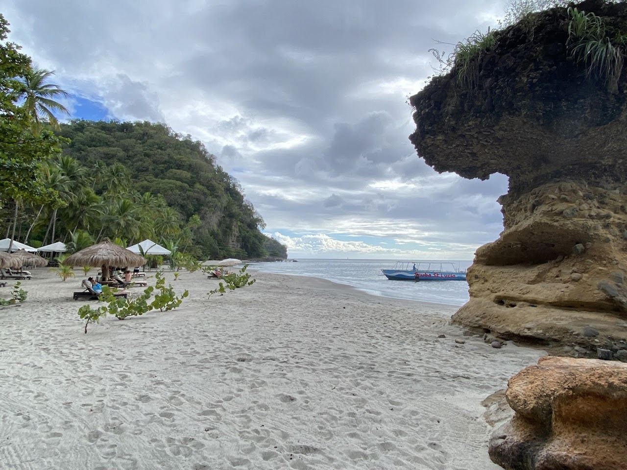 Quiet hidden cove backed by green hills on the west coast of St Lucia used for the secluded beaches guide on Beaches for Kings