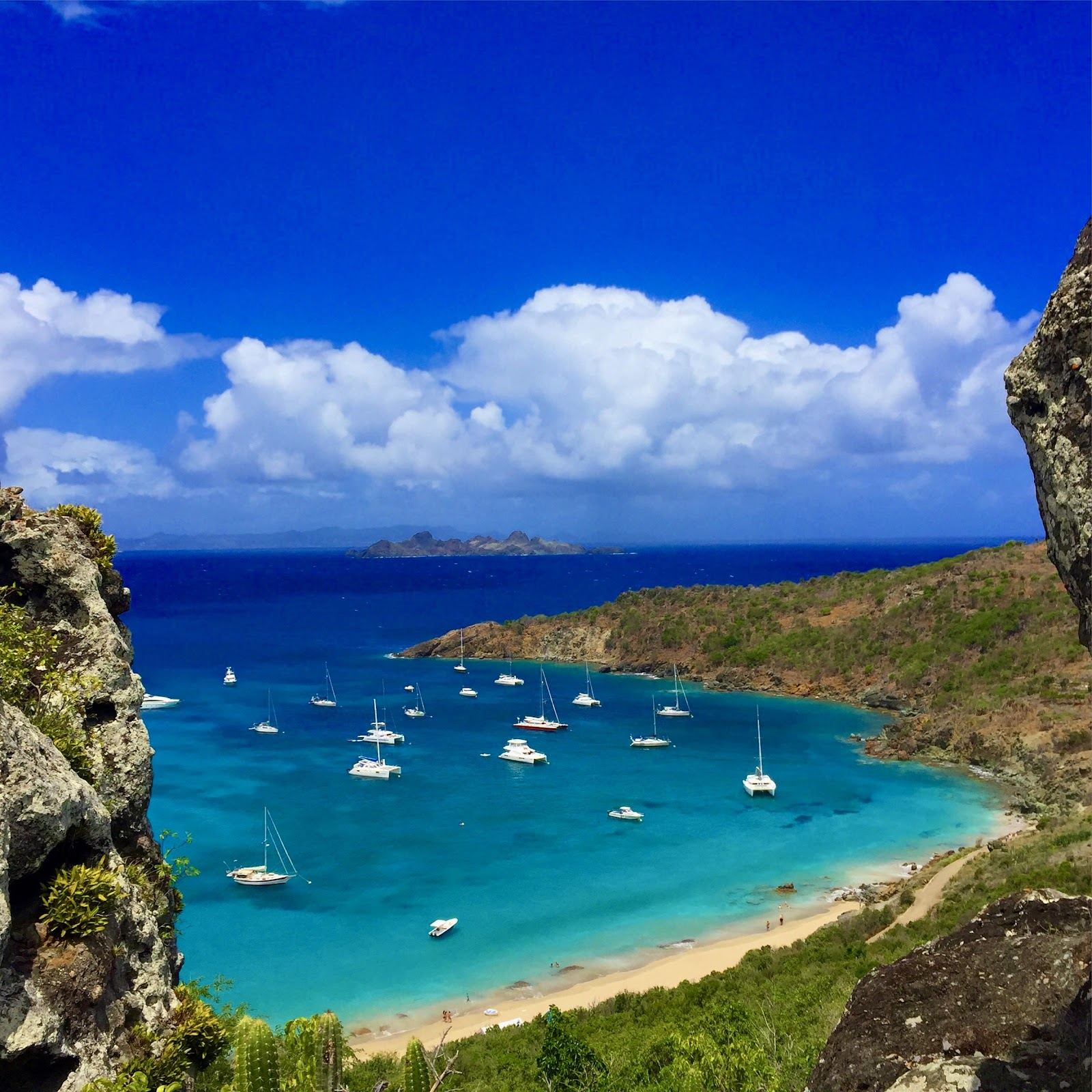 Empty golden sand and clear calm water at Anse de Colombier on the wild north west tip of St Barths