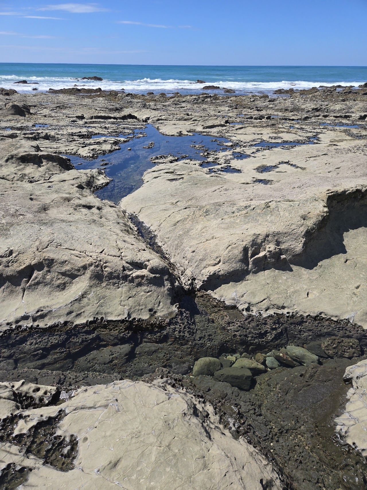 Rocky coastline and tide pools at Playa Mal Pais near Santa Teresa Costa Rica