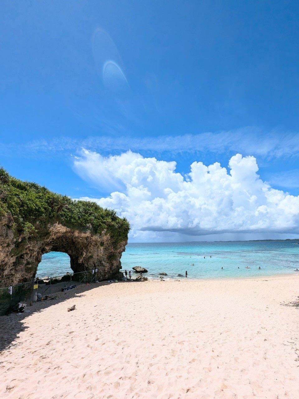 The sunset light through the natural arch at Sunayama Beach on Miyako, Okinawa