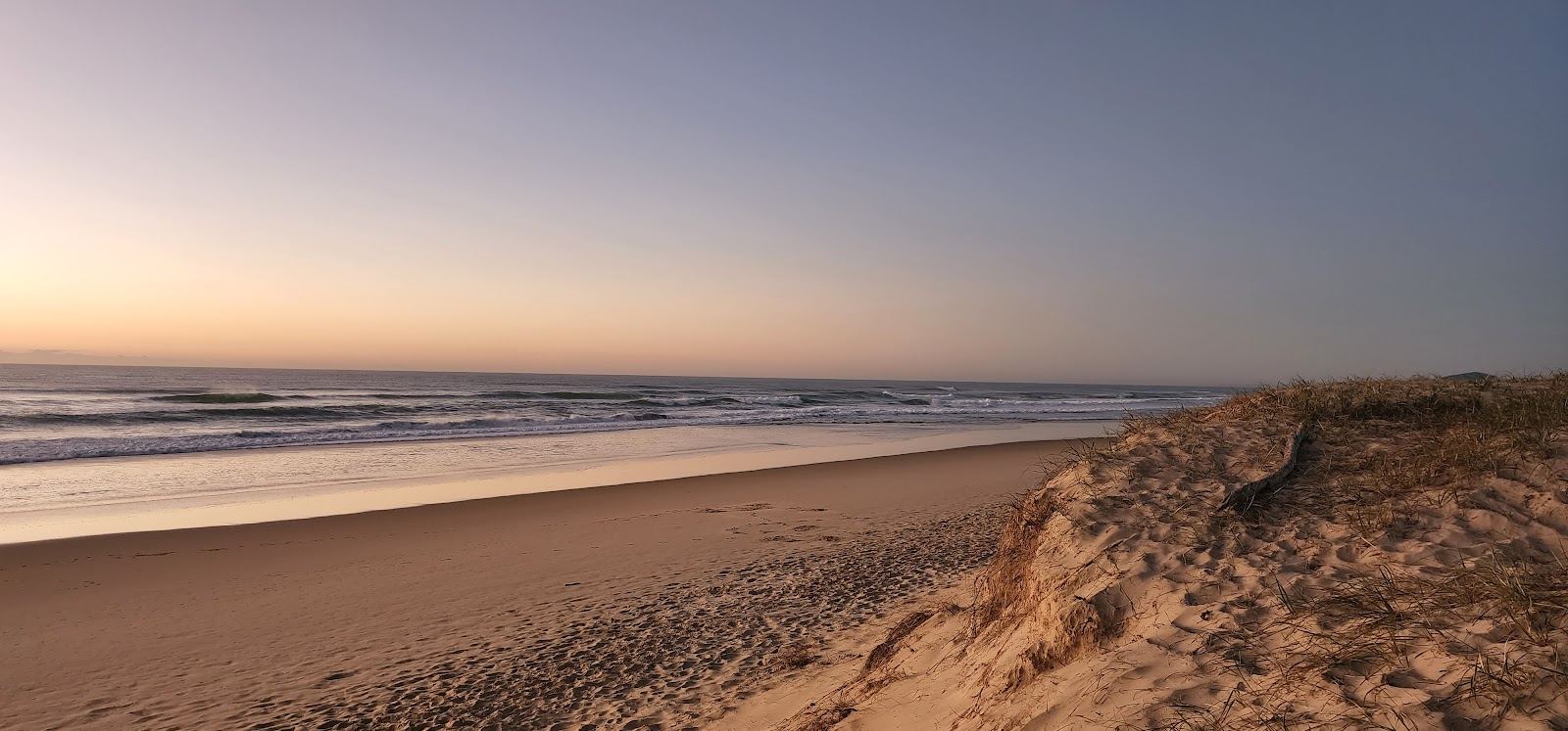 The long open surf sand and dunes of Sunrise Beach on the eastern beaches of Noosa