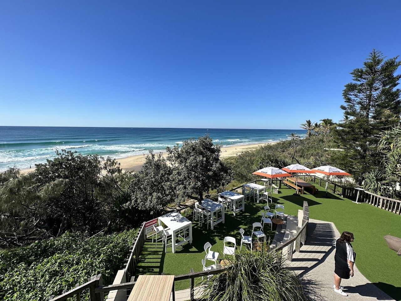 The open sand and dune backed shore by the Sunshine Beach Surf Life Saving Club in Noosa
