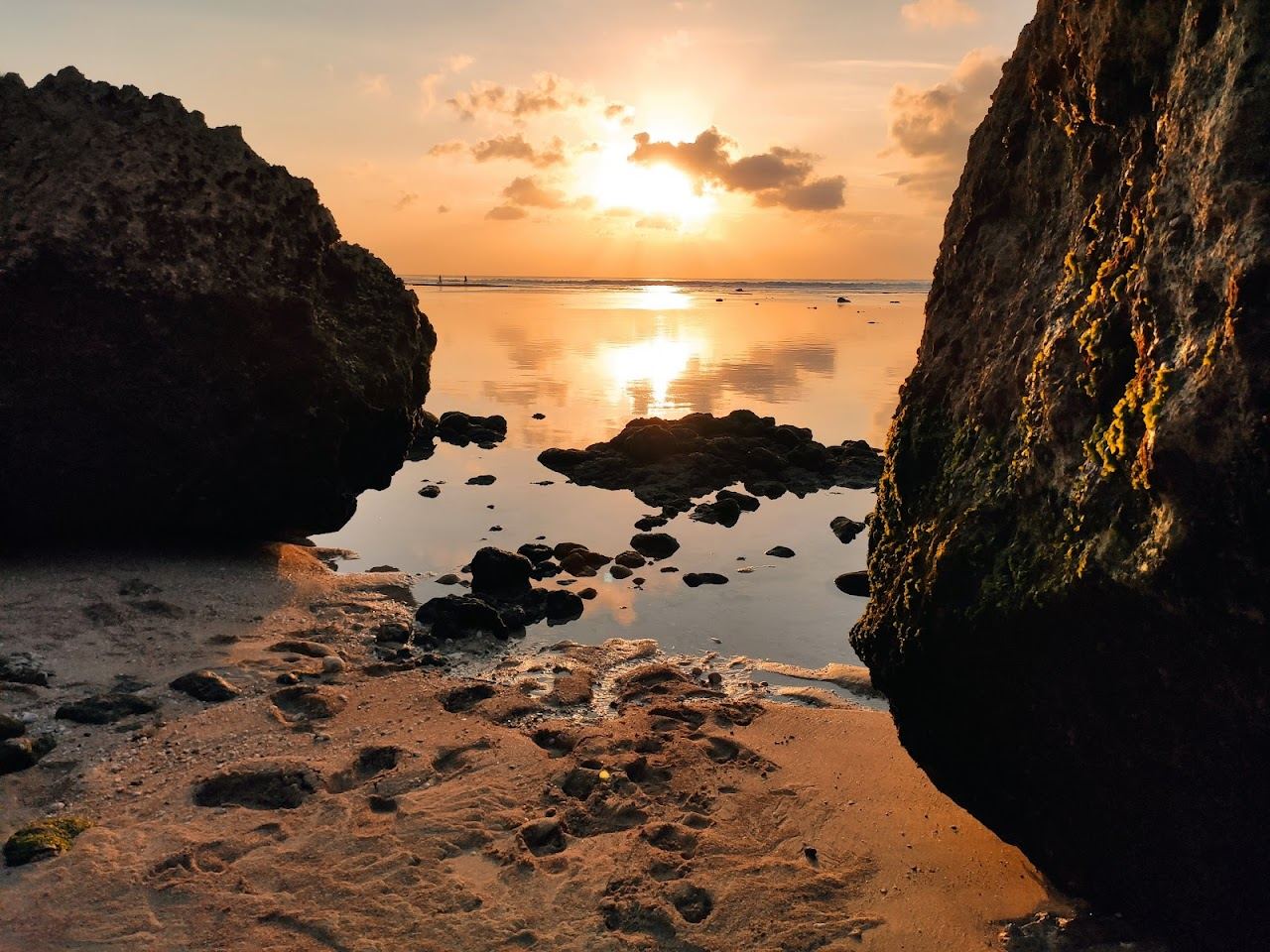 The cliff warungs and shallow reef wave at Bingin Beach in Bali
