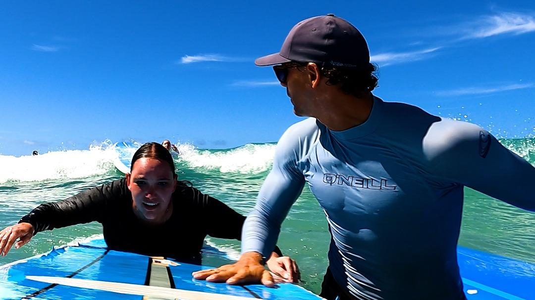 Surfers on the gentle rolling waves at Waikiki Oahu