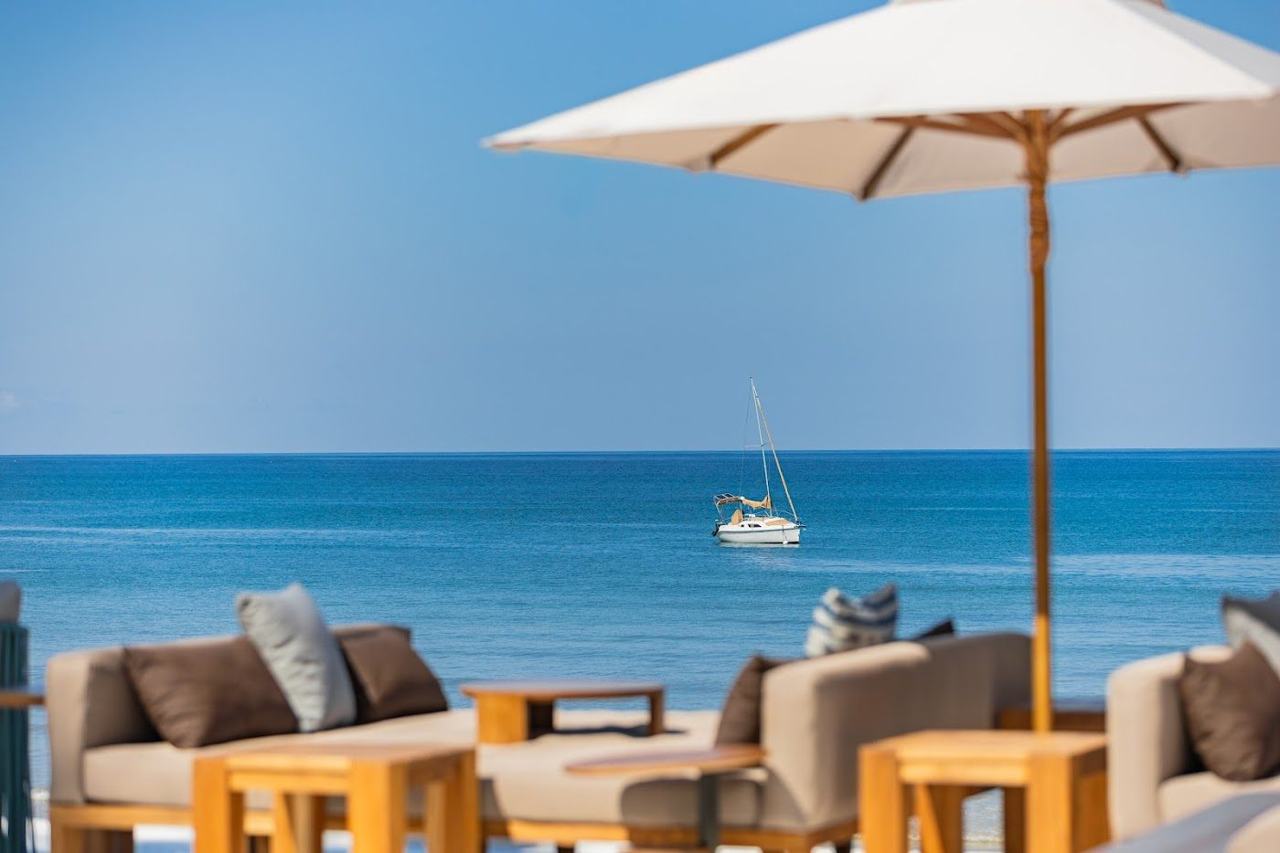 Daybeds and sea view at a beach club on Bang Tao near Surin in Phuket