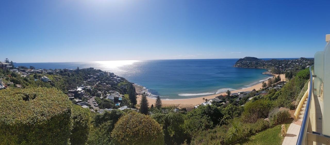 The deep gold sand and headlands of Whale Beach in Sydney