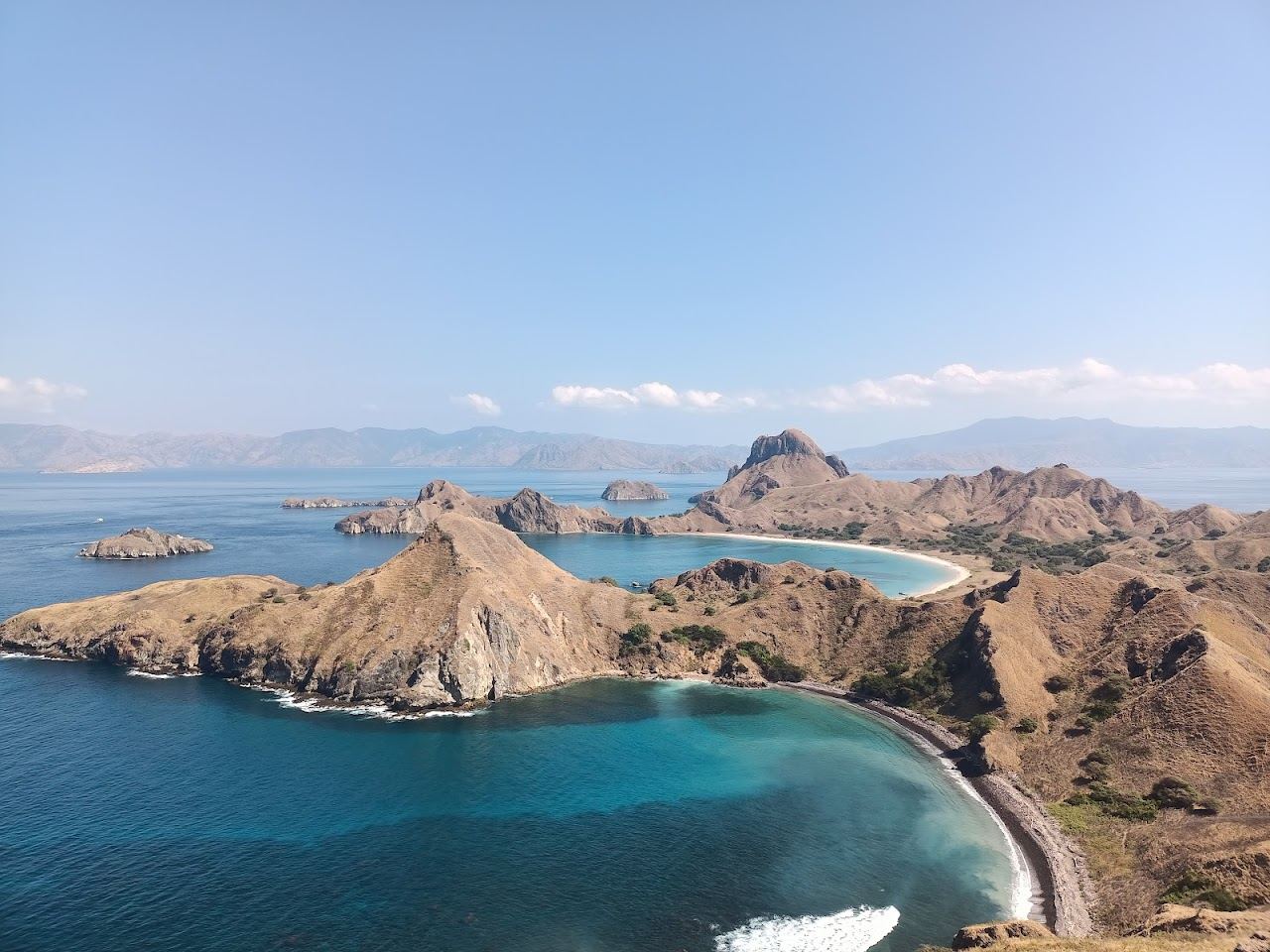 A tiny pink sandbar ringed by turquoise shallows at Taka Makassar in Komodo