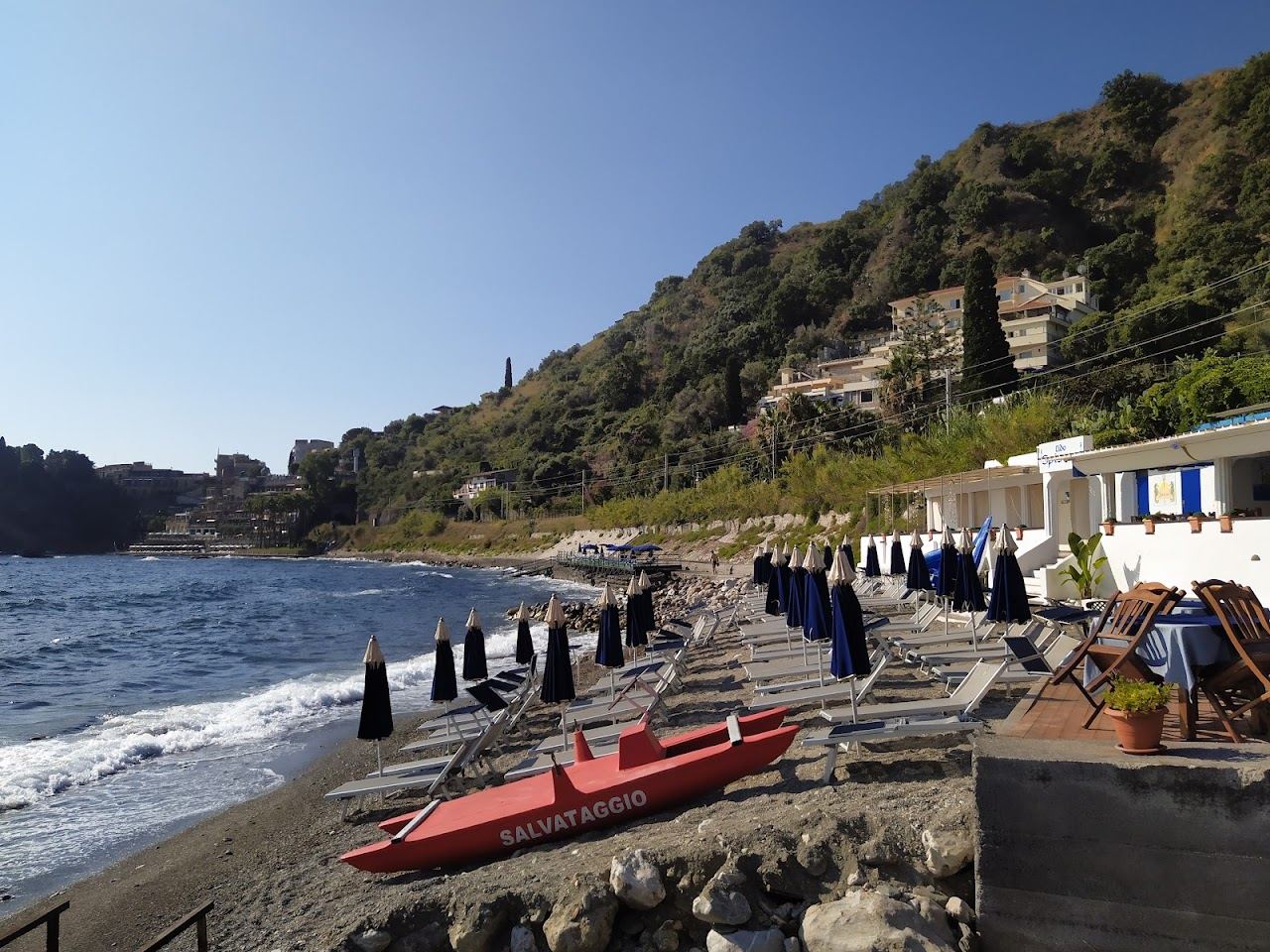 Blue Ionian water and the coast below Taormina near the Spisone and Isola Bella shore in Sicily