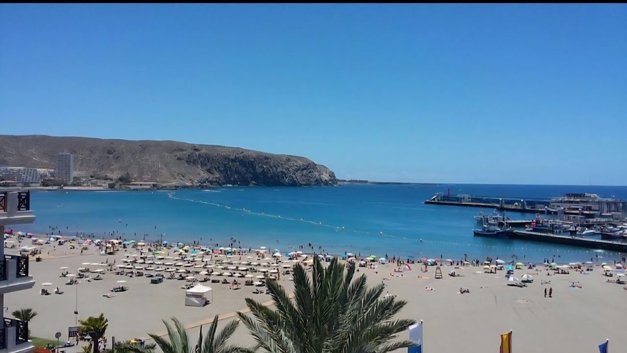Calm sheltered family sand and shallow water at Los Cristianos in Tenerife
