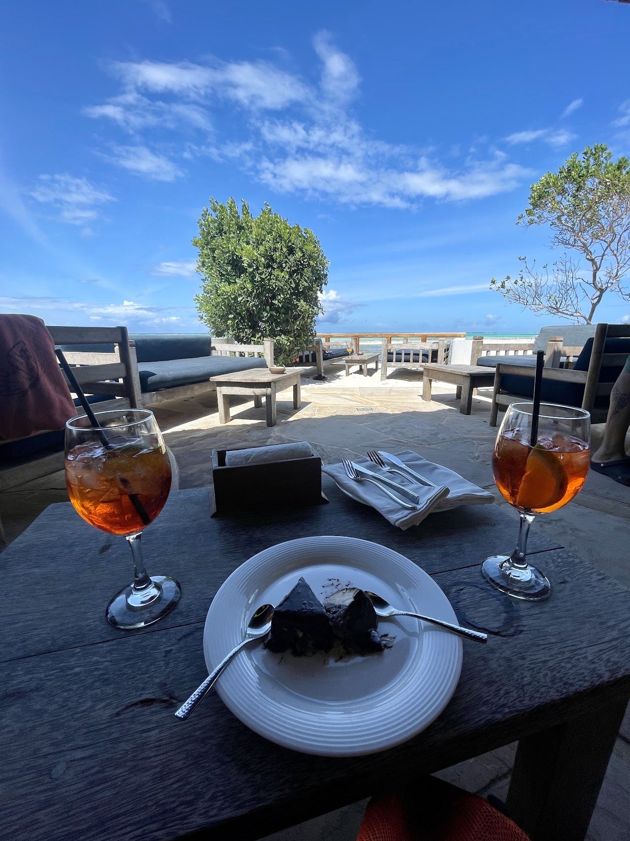 The Rock Restaurant standing on its coral outcrop in turquoise water off Michamvi Pingwe beach, Zanzibar