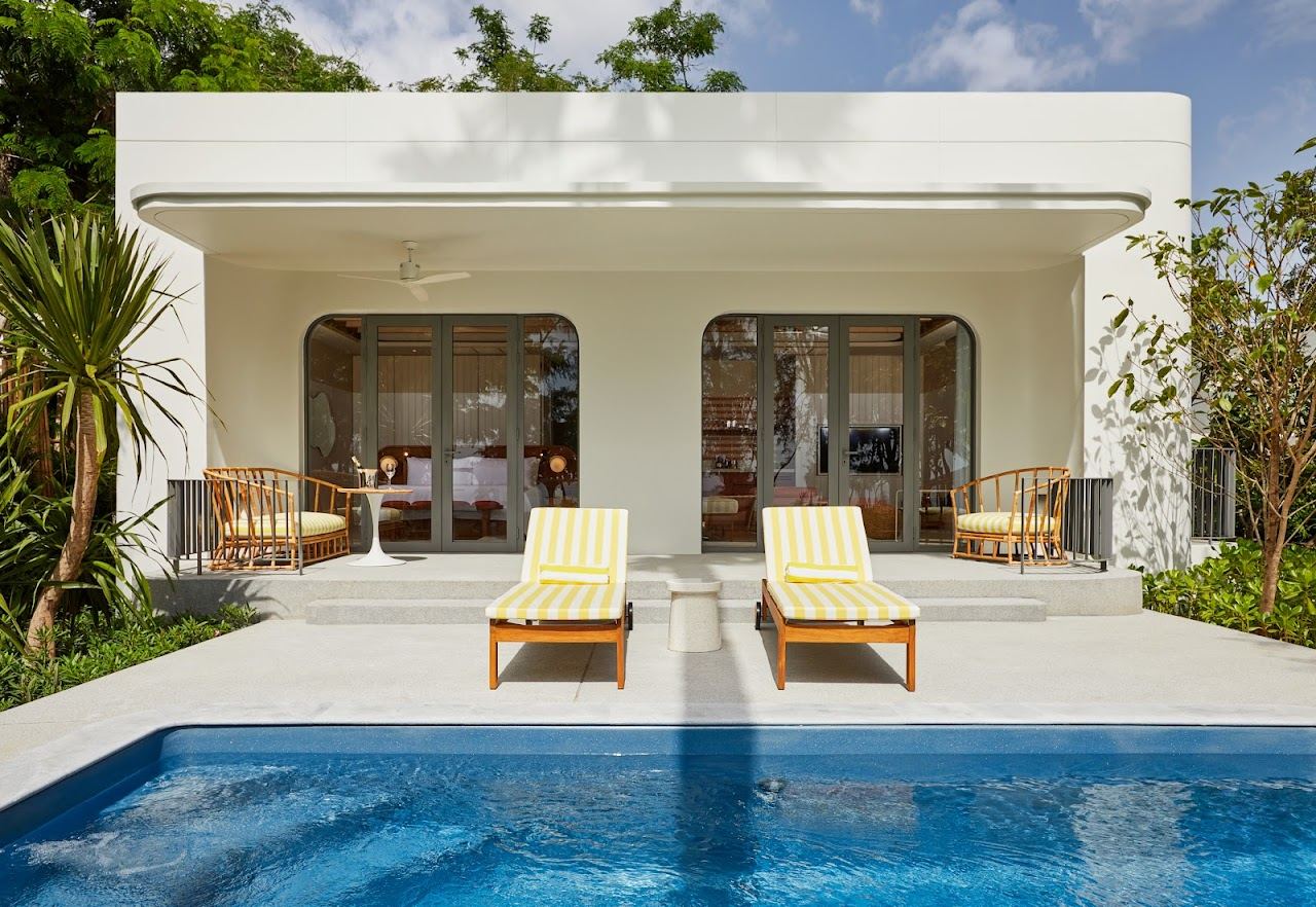 A colourful beachfront pool and loungers at The Standard on the Hua Hin shore