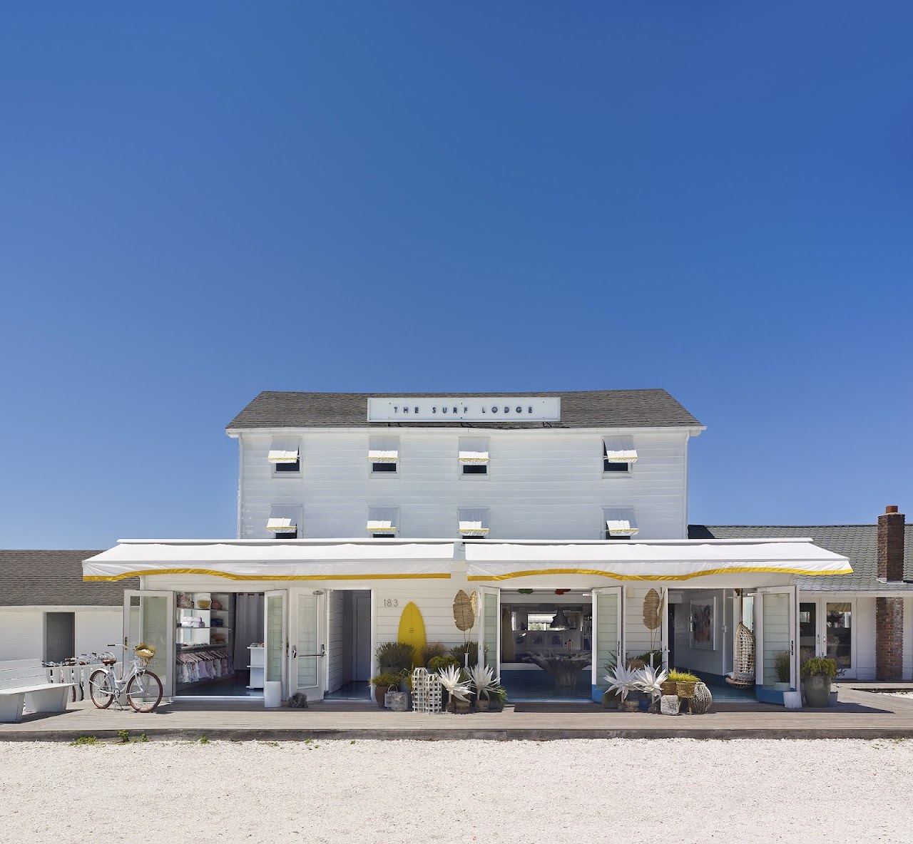 The deck and waterside seating of The Surf Lodge on Fort Pond in Montauk