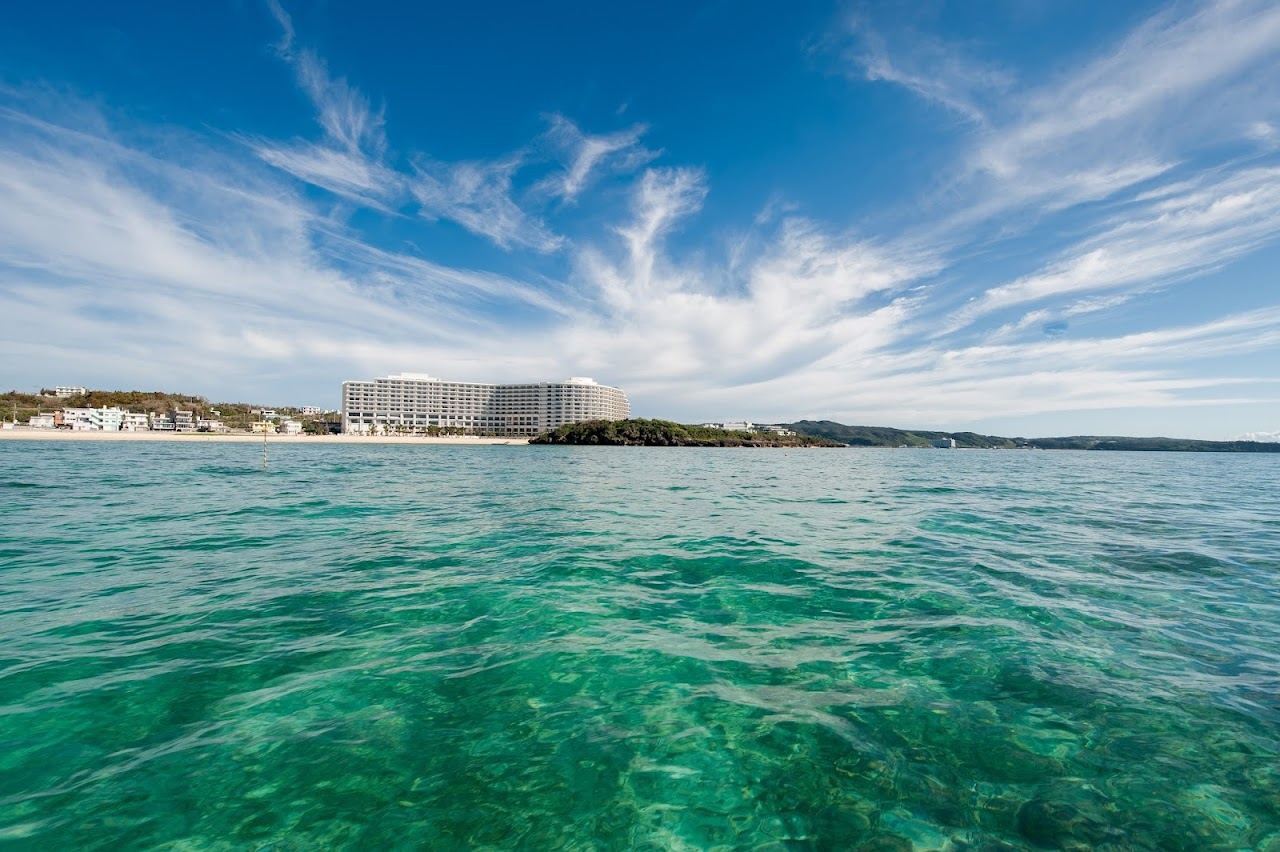 White sand and clear blue water at Tiger Beach in front of the resort at Fuchaku, Onna
