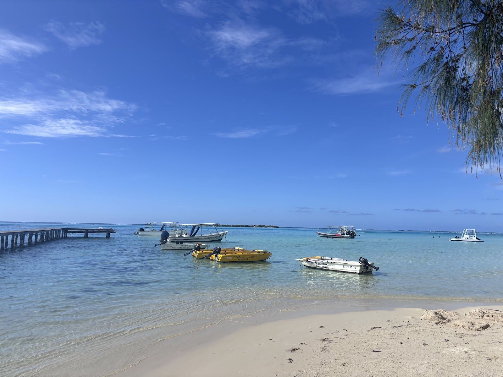 The white sand and calm lagoon of Tipaniers Beach on the northwest coast of Moorea