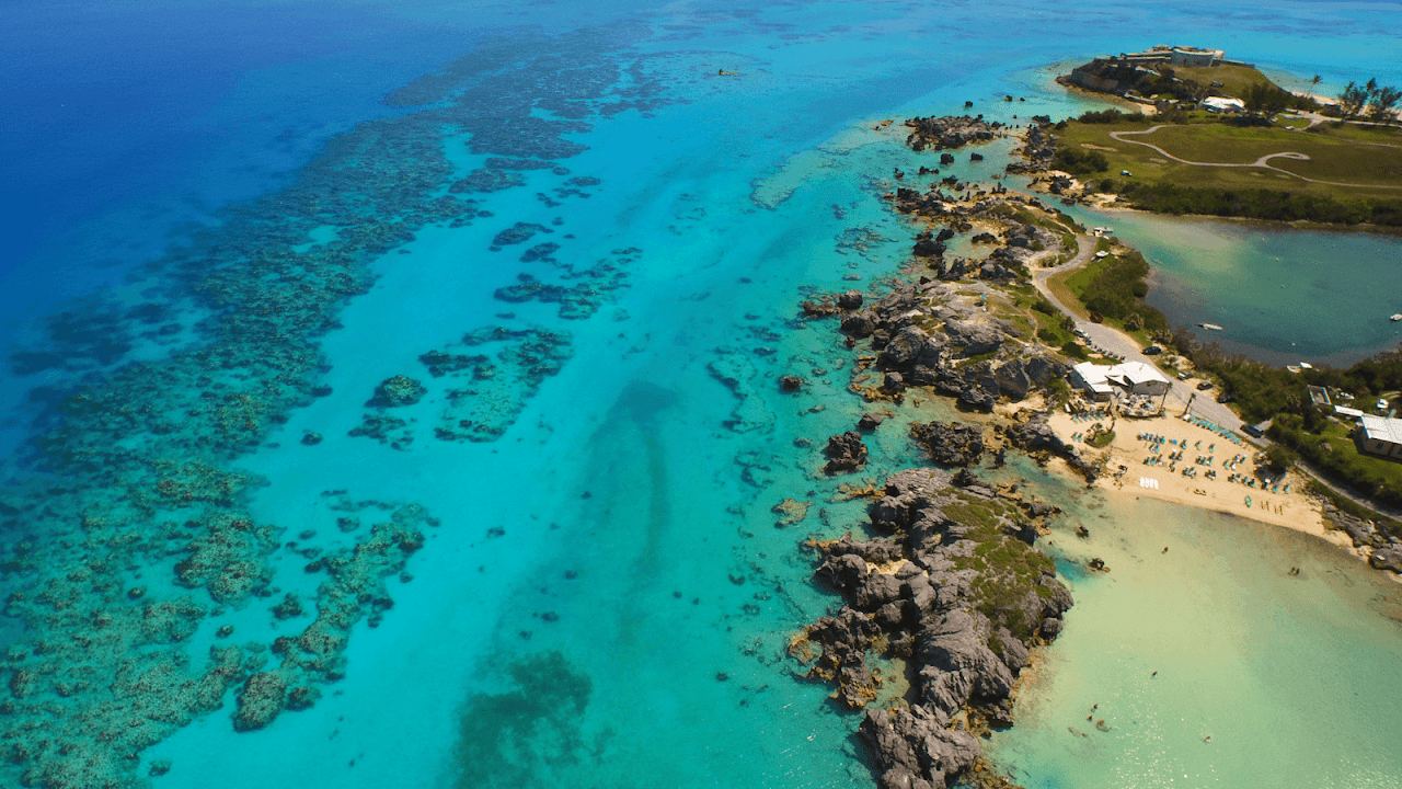 The beach bar and limestone stacks behind the sheltered cove at Tobacco Bay near St George's, Bermuda