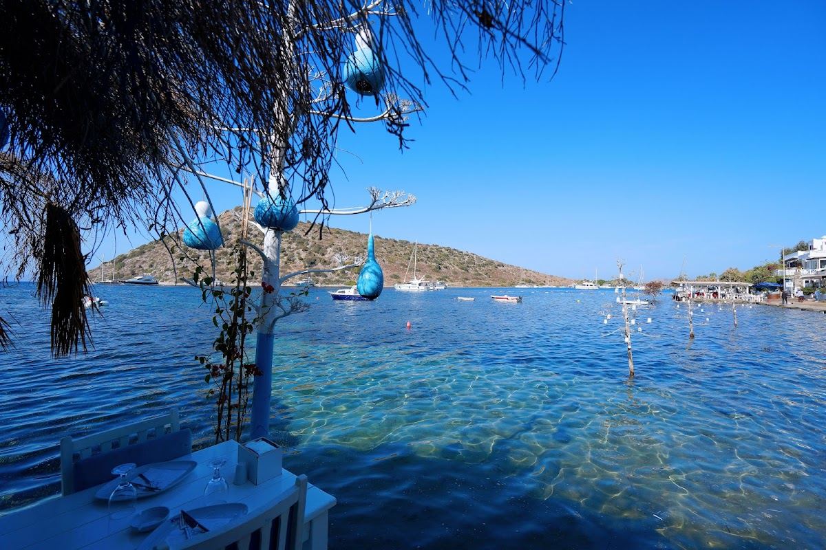 Sunset over the shallows and Rabbit Island at Gumusluk in Bodrum