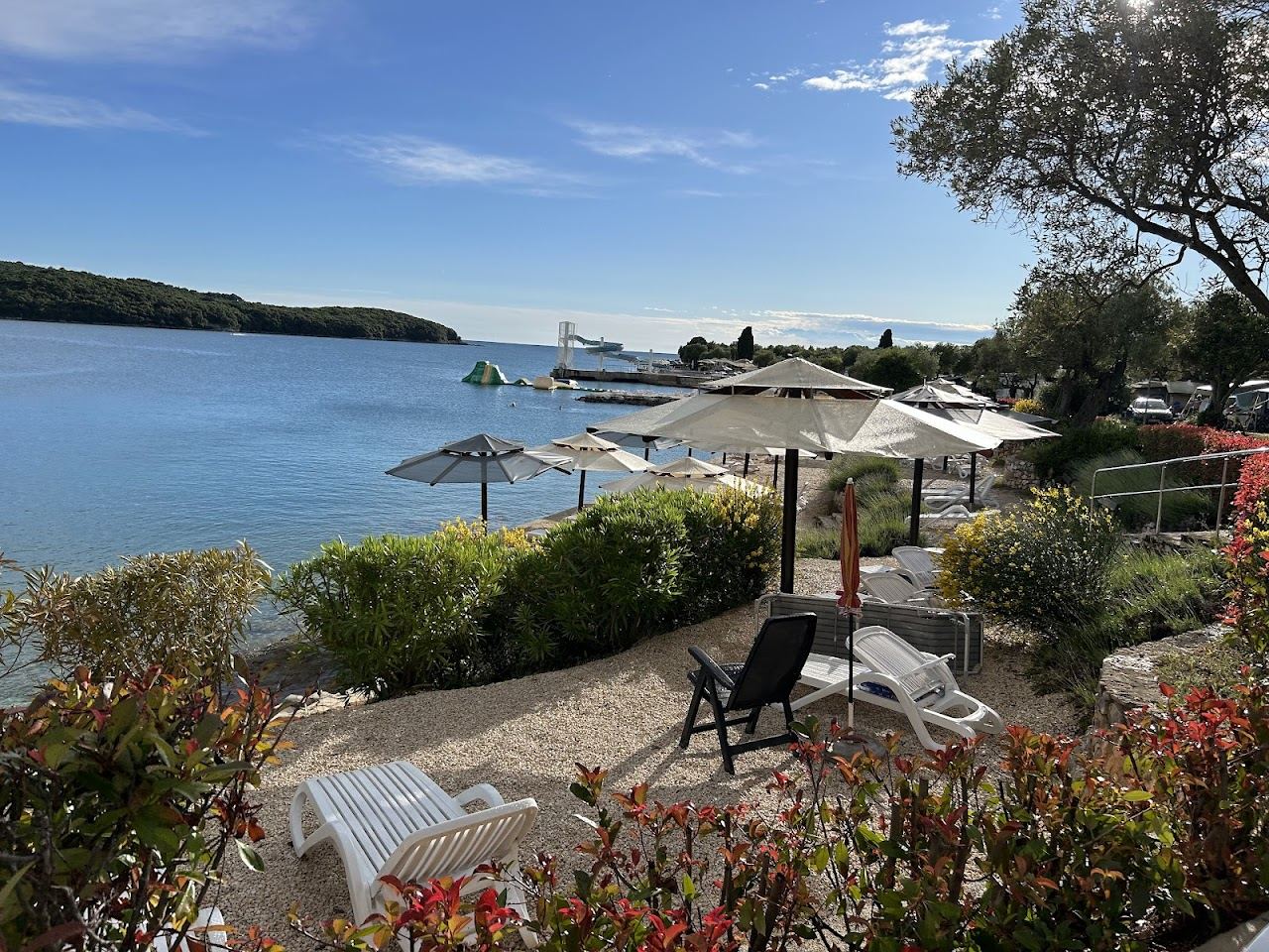Clear water and long pebble shore at the Valalta naturist resort north of Rovinj in Istria