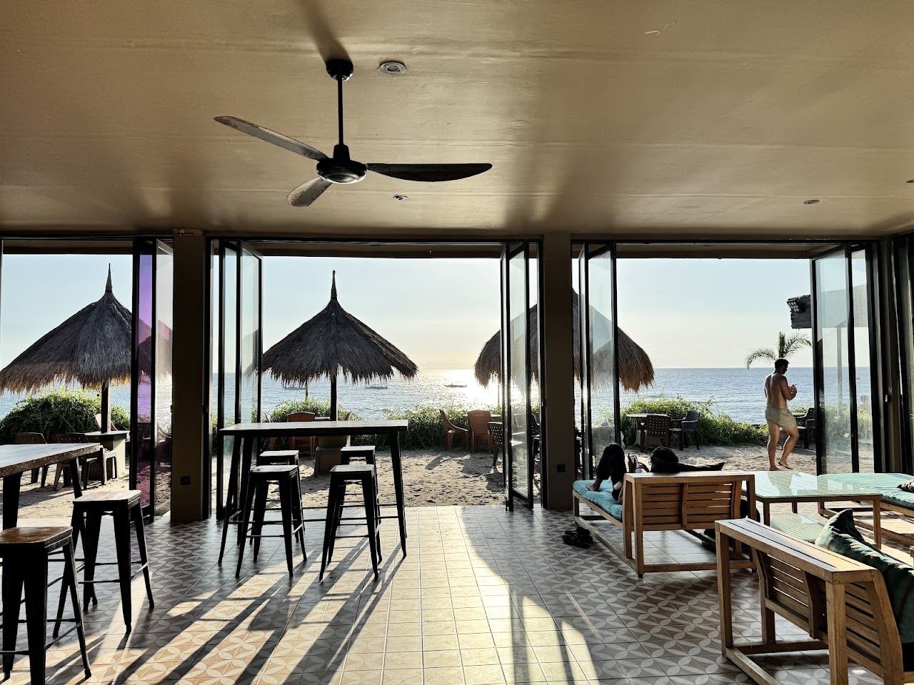 The deck and loungers of Verve Beach Club facing the water on the Senggigi coast of west Lombok