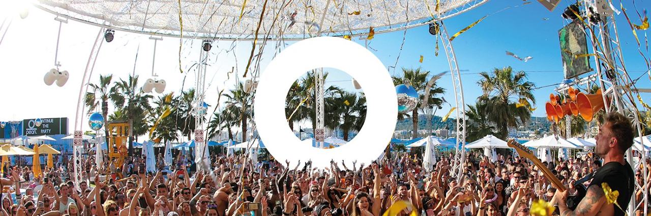 Pool, daybeds and crowds at O Beach Ibiza in San Antonio