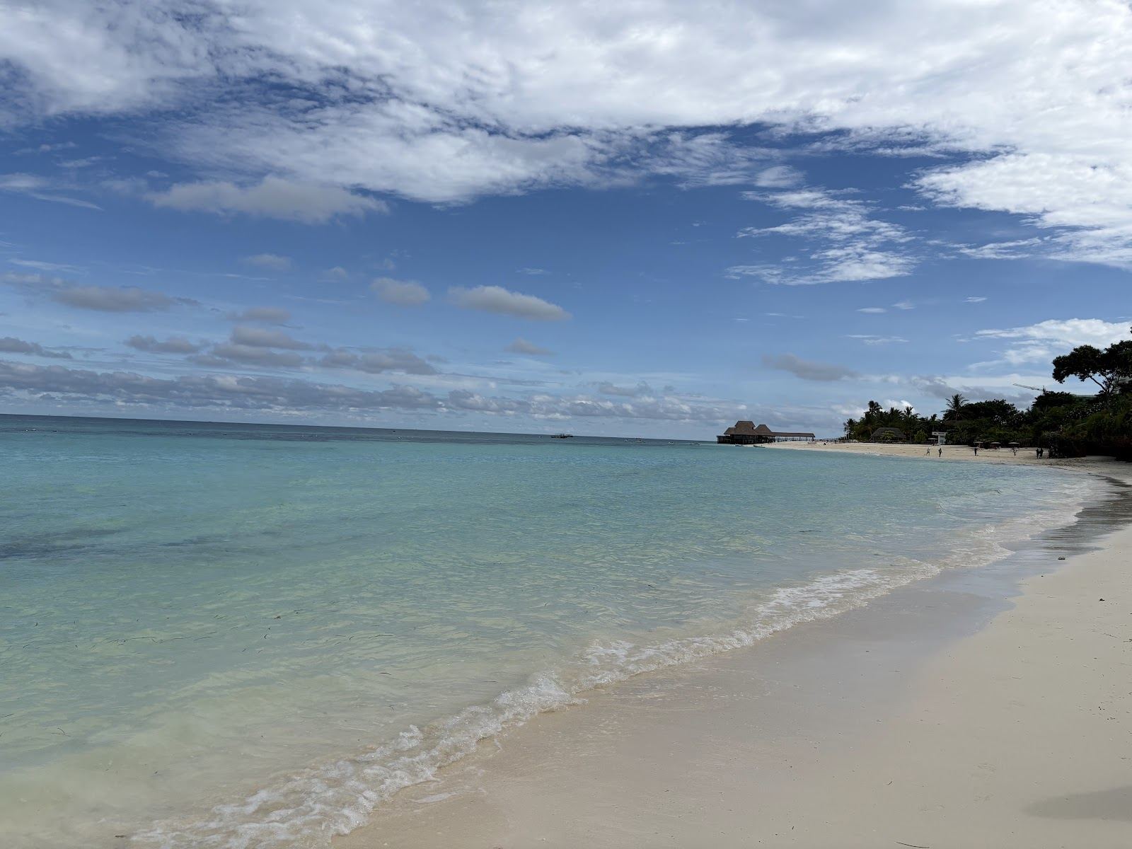 White sand and turquoise water at Kendwa beach on the north coast of Zanzibar, where the island's liveliest beach bars sit