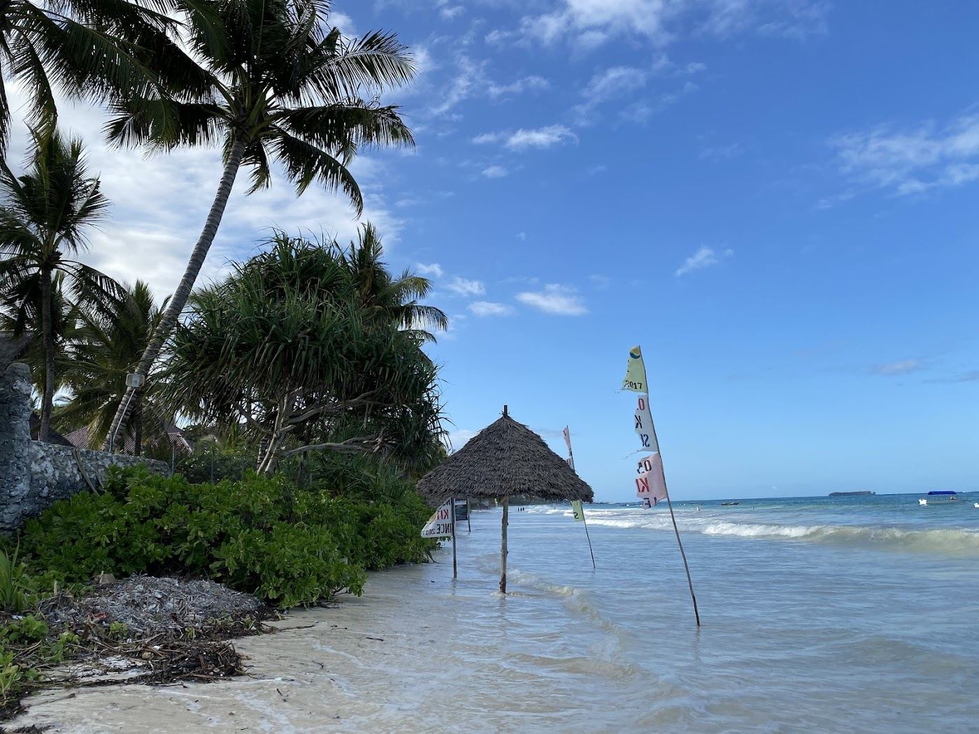 Turquoise water and a dhow over the reef off Matemwe on the northeast coast of Zanzibar