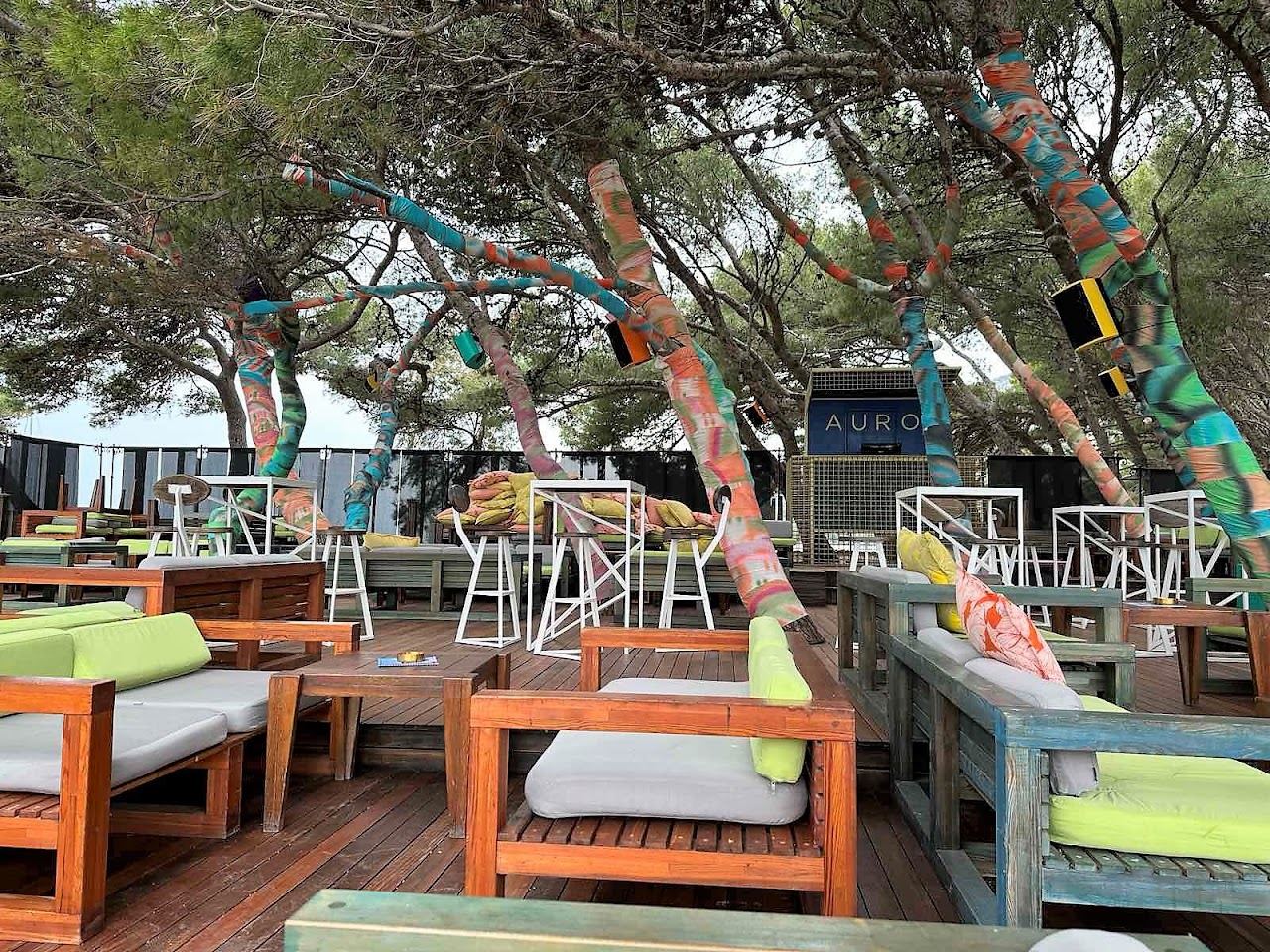 The pointed shingle spit of Zlatni Rat at Bol on Brac with loungers, umbrellas and pines